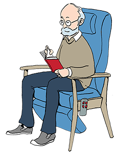 Mand sidder i hvilestol og læser en bog