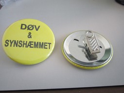 Yellow badge with clips Text: Deaf and visually impaired