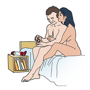 Couple without clothes sitting on bed